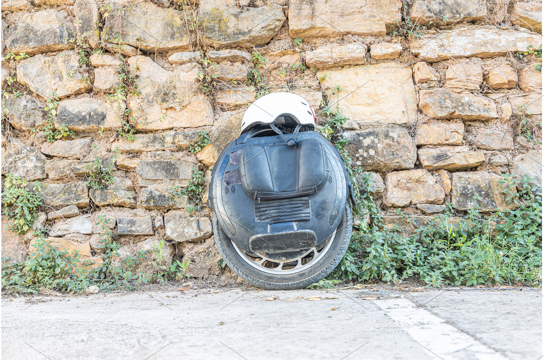 Black Electric unicycle and a white, a Sports & Recreation Photo by Illustrations&photos