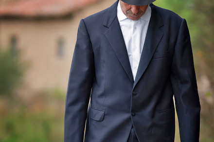 emigrant with suitcase and vintage suit leaving his village to l