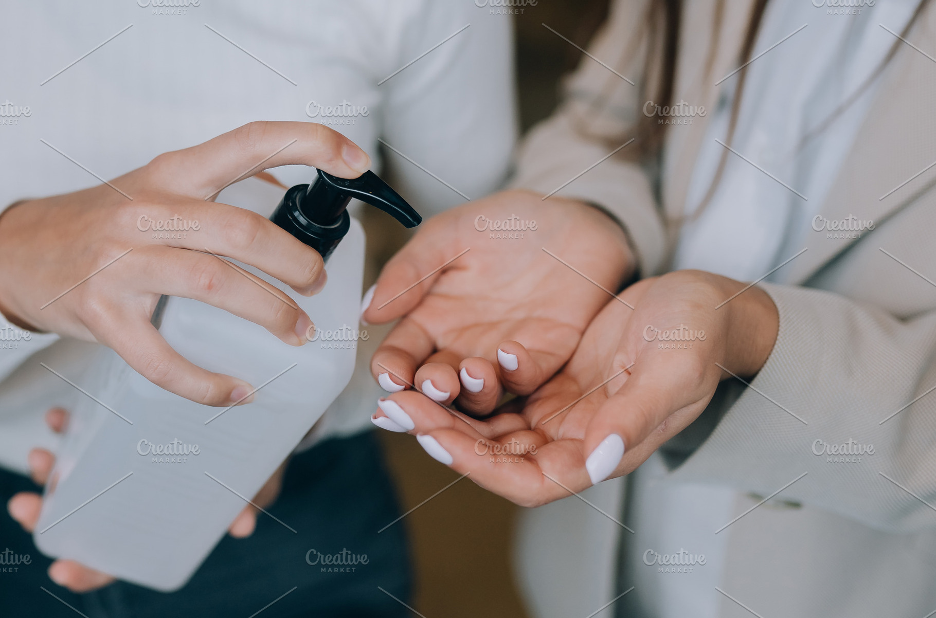 Female hands applying antibacterial liquid soap close up., a Person Photo by Tekso