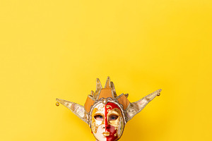 Colorful Venetian jester mask with gold detailing and dramatic d, a Holiday Photo by Ales Munt