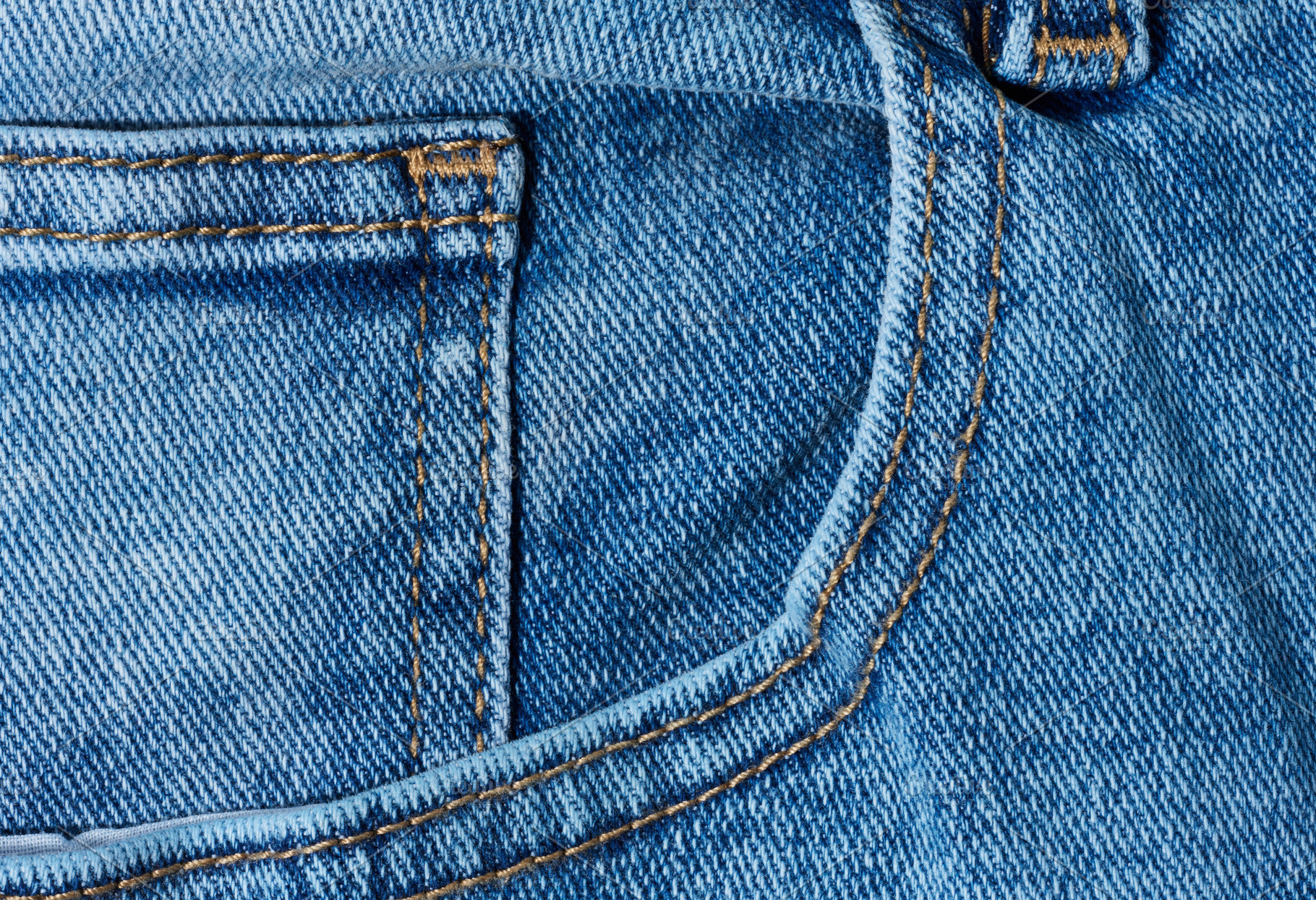 Close up of blue denim jeans showing a front pocket corner with, a Background Photo by ndanko