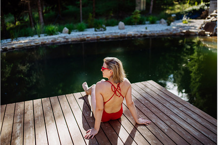 Rear view of young woman in swimsuit, a Nature Photo by HalfPoint