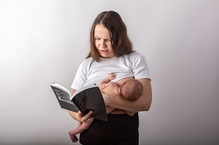 Beautiful young mother breastfeeding featuring child, mother, and care