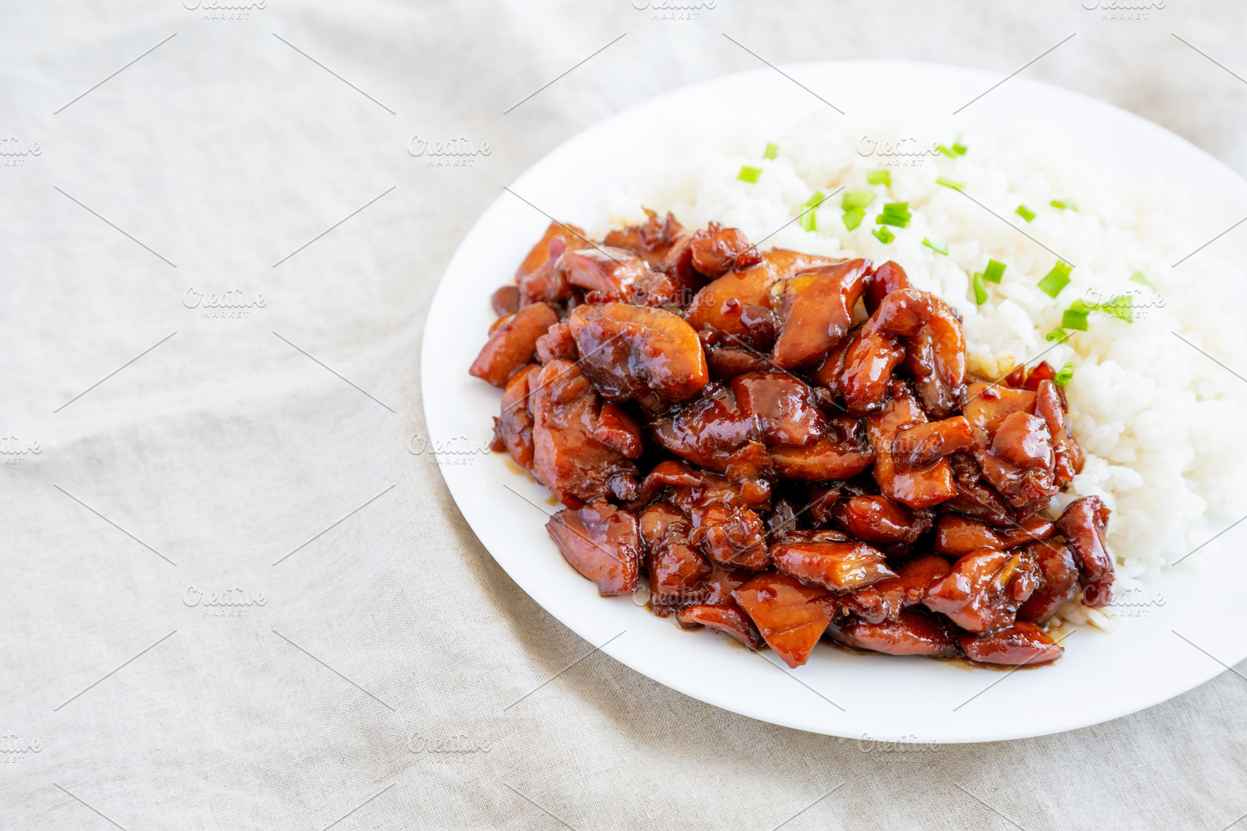 Homemade Teriyaki Chicken with White Rice on A Plate, side view., a Food & Drink Photo by LiudmylaChuhunova