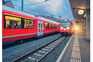 Red modern trains on mountain, a Transportation Photo by den-belitsky