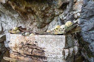 Toraja tombs and skulls in cave sanctuary, Sulawesi, Indonesia, an Architecture Photo by GoodGoods
