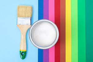 Open paint enamel cans on color pale containing can, paint, and color