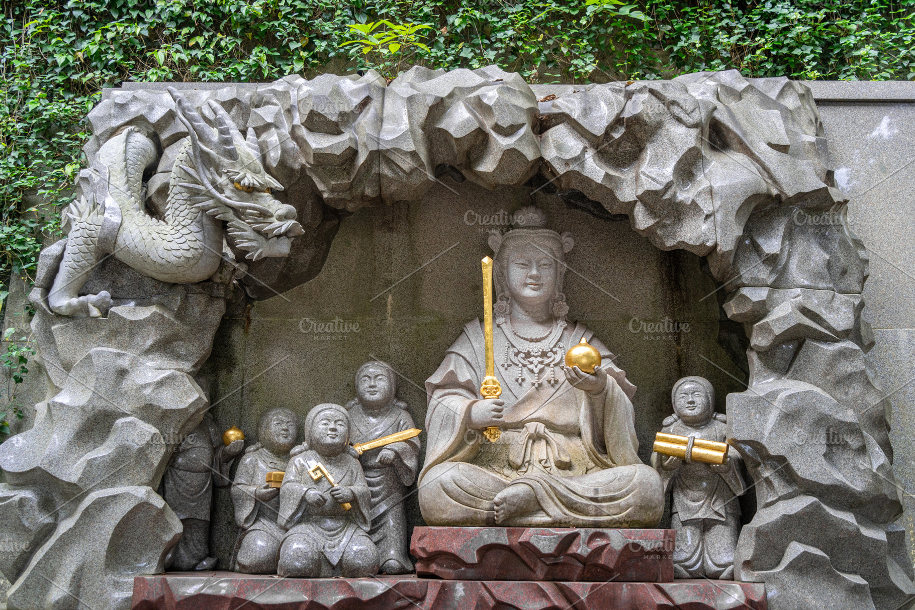 Benzaiten statue with dragon on Enoshima Island in Japan, an Architecture Photo by GoodGoods