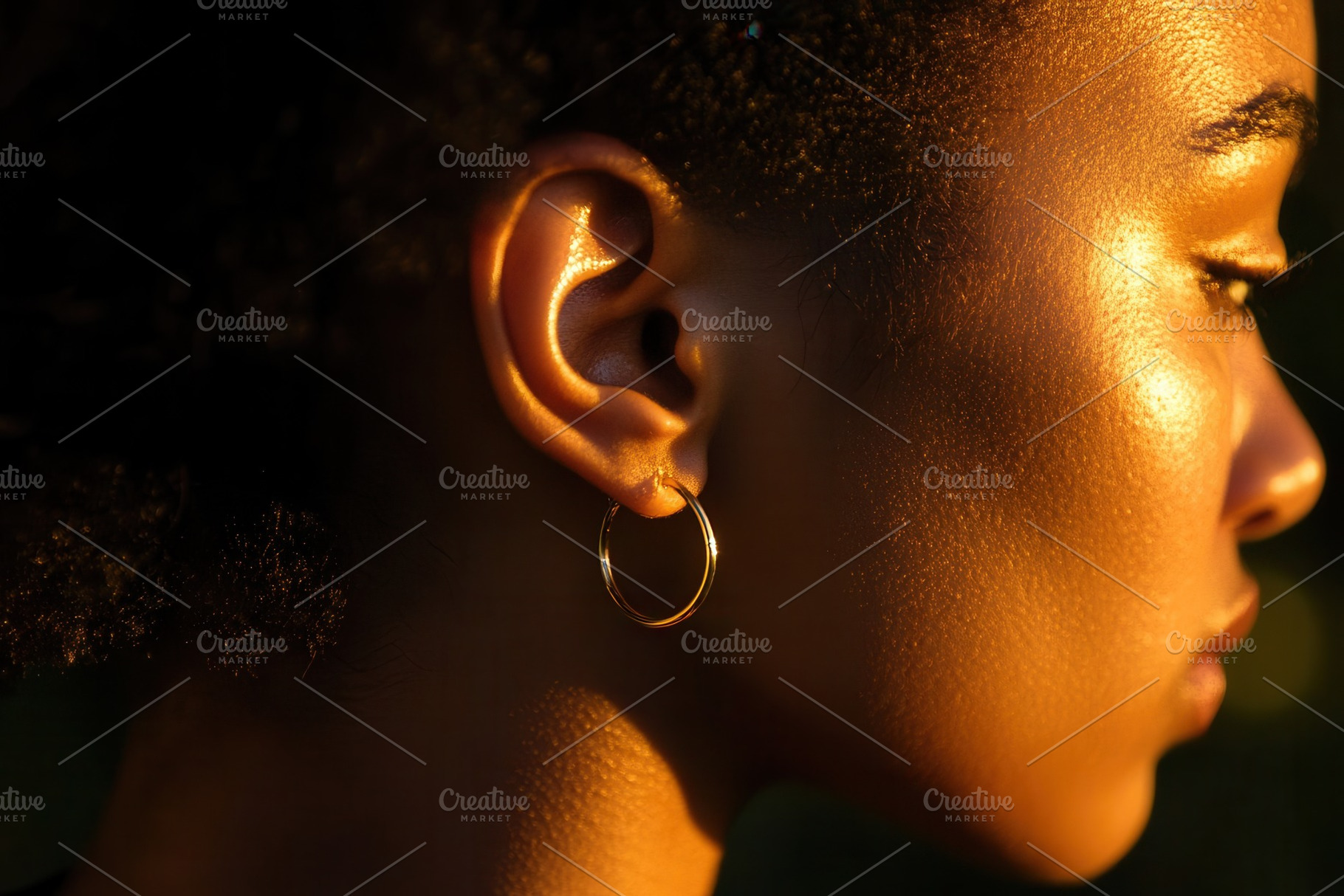 A gold hoop earring on a womans ear, a Photo by Pavel_design