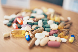 Healthcare, tablets or table with medicine pills or supplements products at drugstore clinic. Pharmaceuticals background, blur or medical products, depression anxiety supplements or stress medication, a Photo by Peopleimages.com