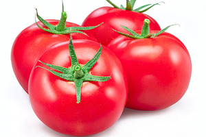 Red tomatoes isolated on white, a Food & Drink Photo by Volff