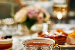 Elegant tea cup and pastry on a table setting, enjoying high tea, a Food & Drink Photo by Studio ANNA