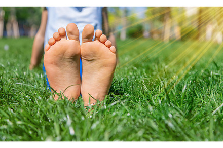 Children's feet on the grass, a Nature Photo by yanadjana