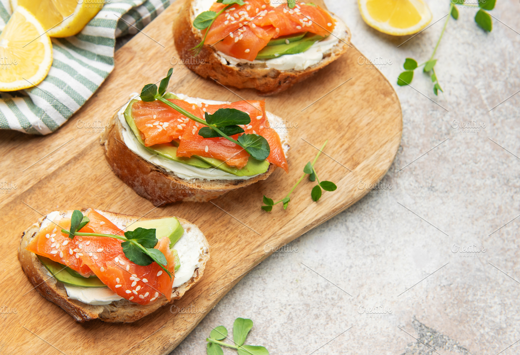 Smoked salmon toast with avocado and cream cheese, a Food & Drink Photo by Olena Rudo