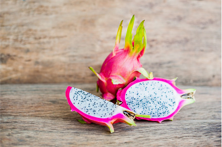 Healthy dragon fruits on old wooden, a Food & Drink Photo by Elizaveta Galitskaya