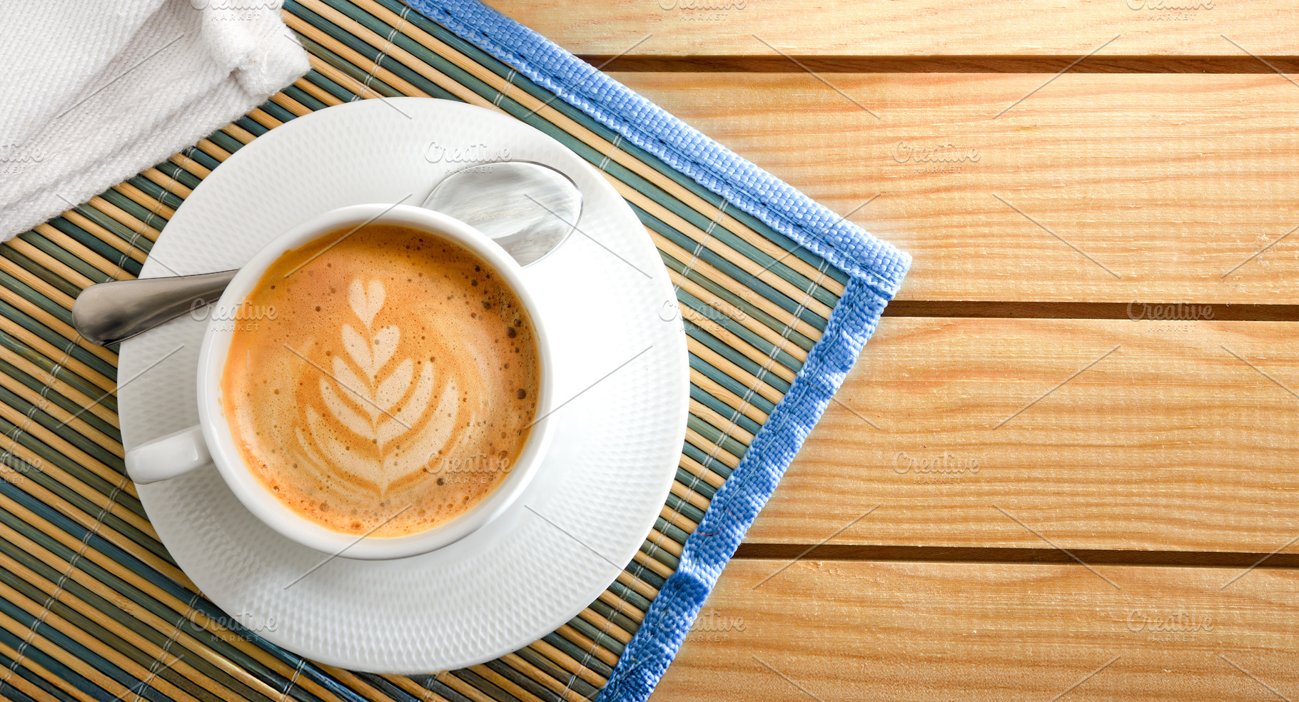 Coffee with flower drawing on wooden table top view, a Food & Drink Photo by Davizro's Market