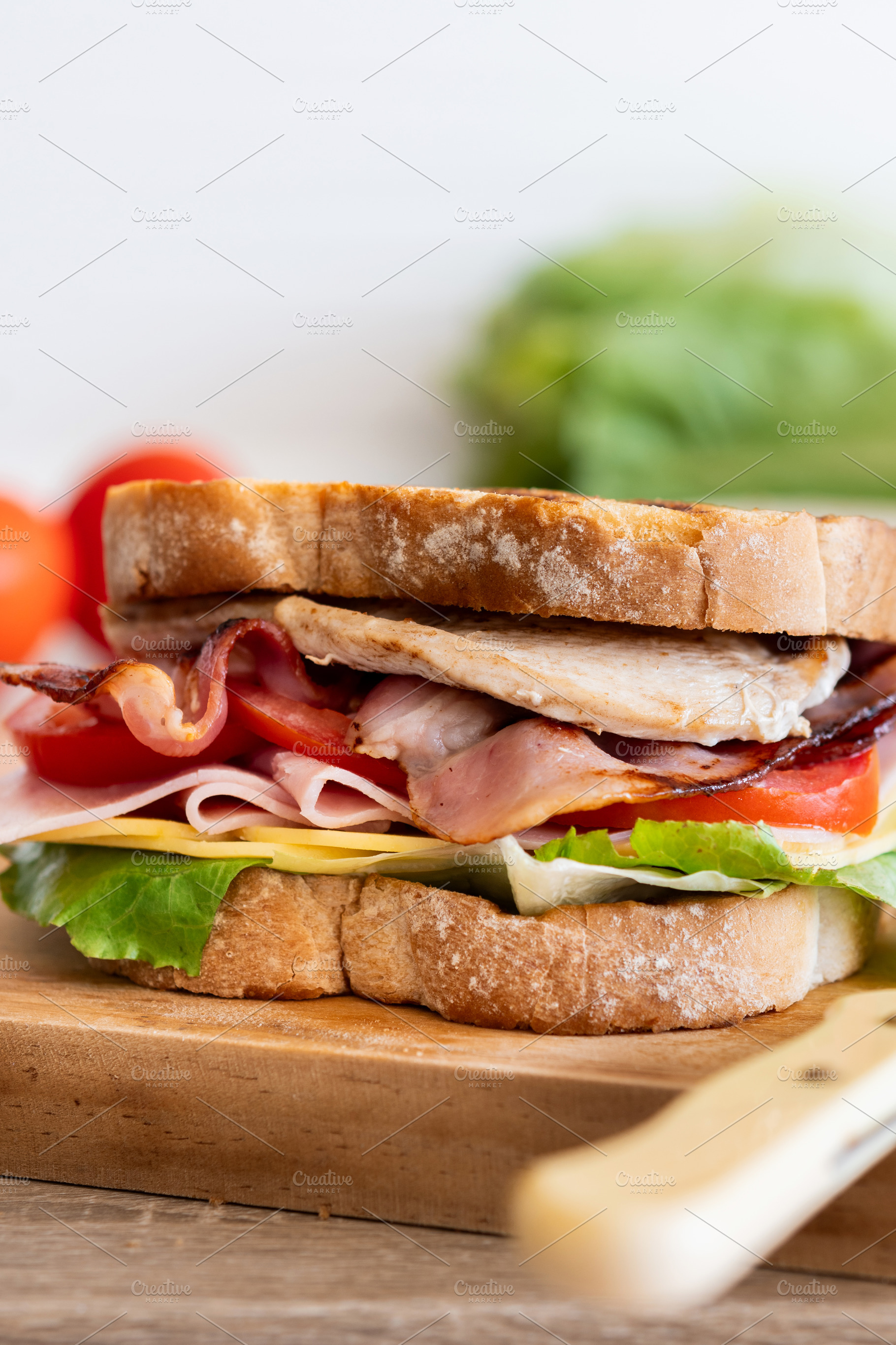 Close Up of Club Sandwich with Bacon, Ham, Cheese and Grilled Chicken, a Food & Drink Photo by etorres69
