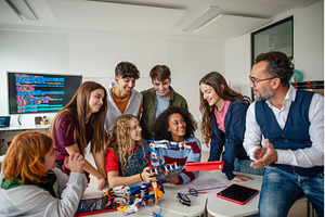 Young students working on robotics, a School & Education Photo by HalfPoint