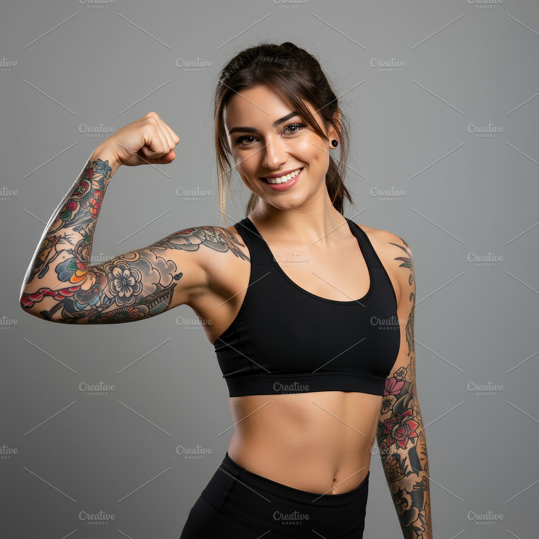 Fit Woman Flexing Arm with Tattoo, a Sports & Recreation Photo by Stock Shape
