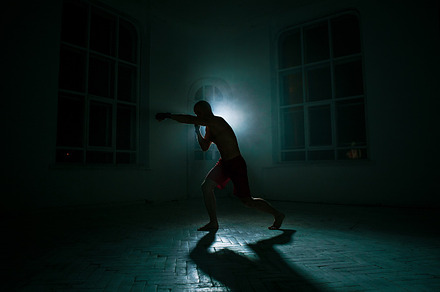 The young man kickboxing on black background containing boxing, kickboxing, a Sports & Recreation Photo by Volodymyr Melnyk