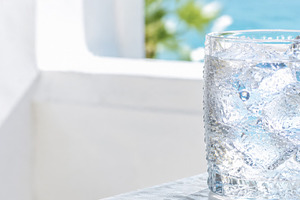 Glass of ice water on sunny day capt, a Photo by Dvoevnore photos