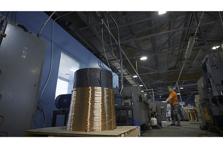 Worker starts machine with copper, an Industrial Photo by Media Whale Stock