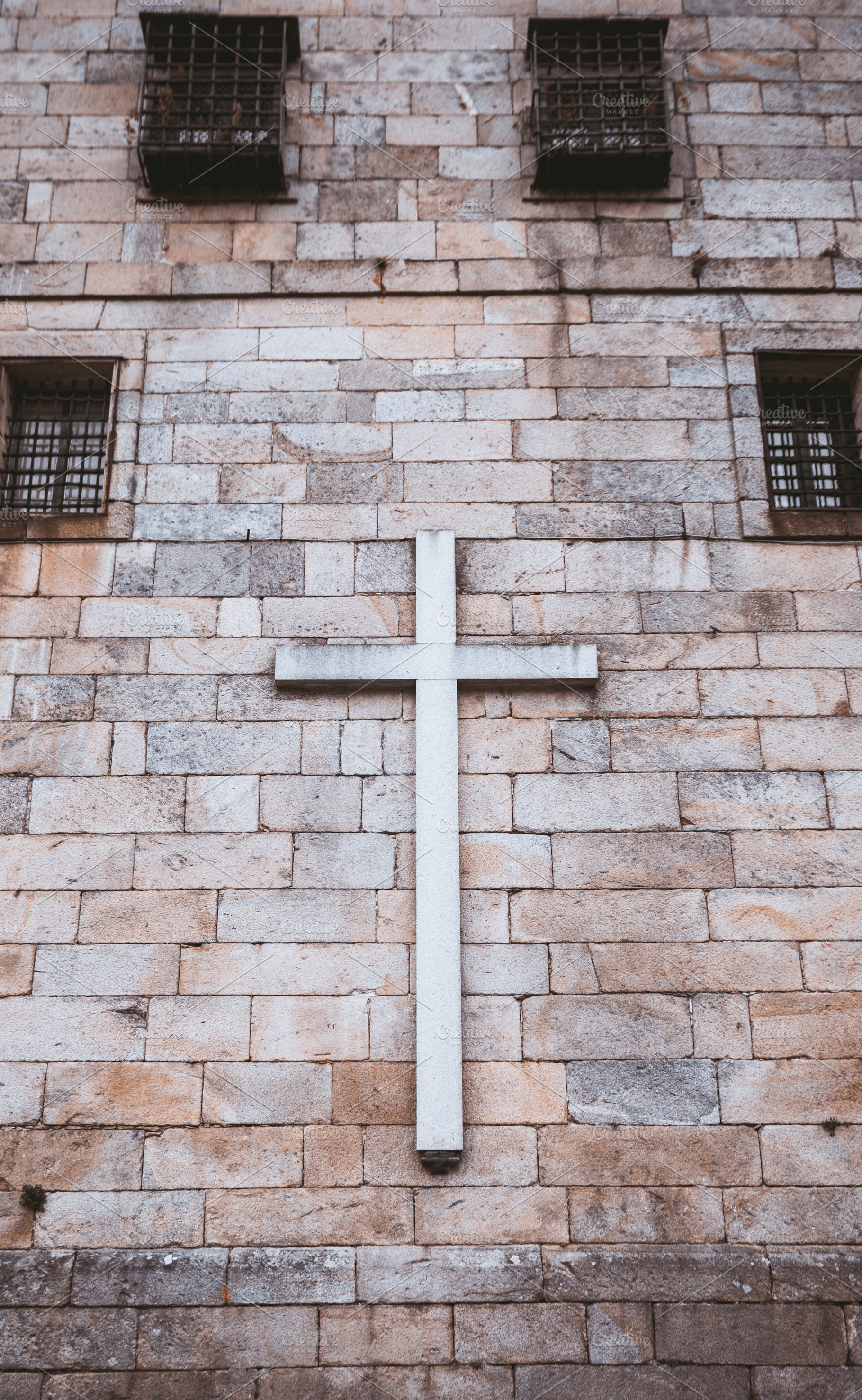 Cross on old stone wall, minimalism, an Architecture Photo by SkyNext