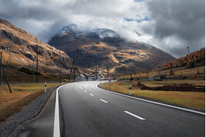 Empty asphalt road in alpine, a Nature Photo by den-belitsky
