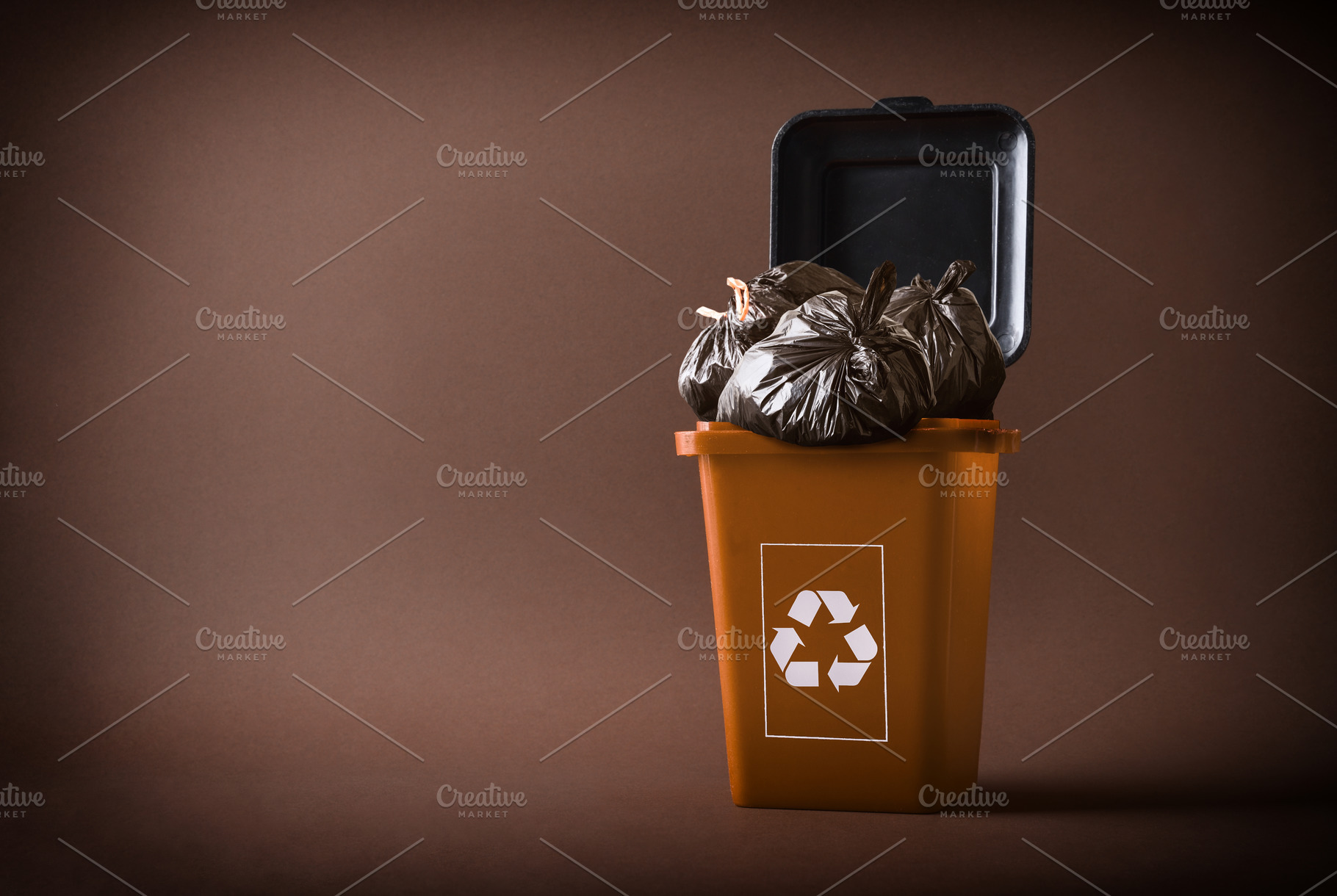 Brown recycling container full of organic waste bags brown isola, a Nature Photo by Davizro's Market