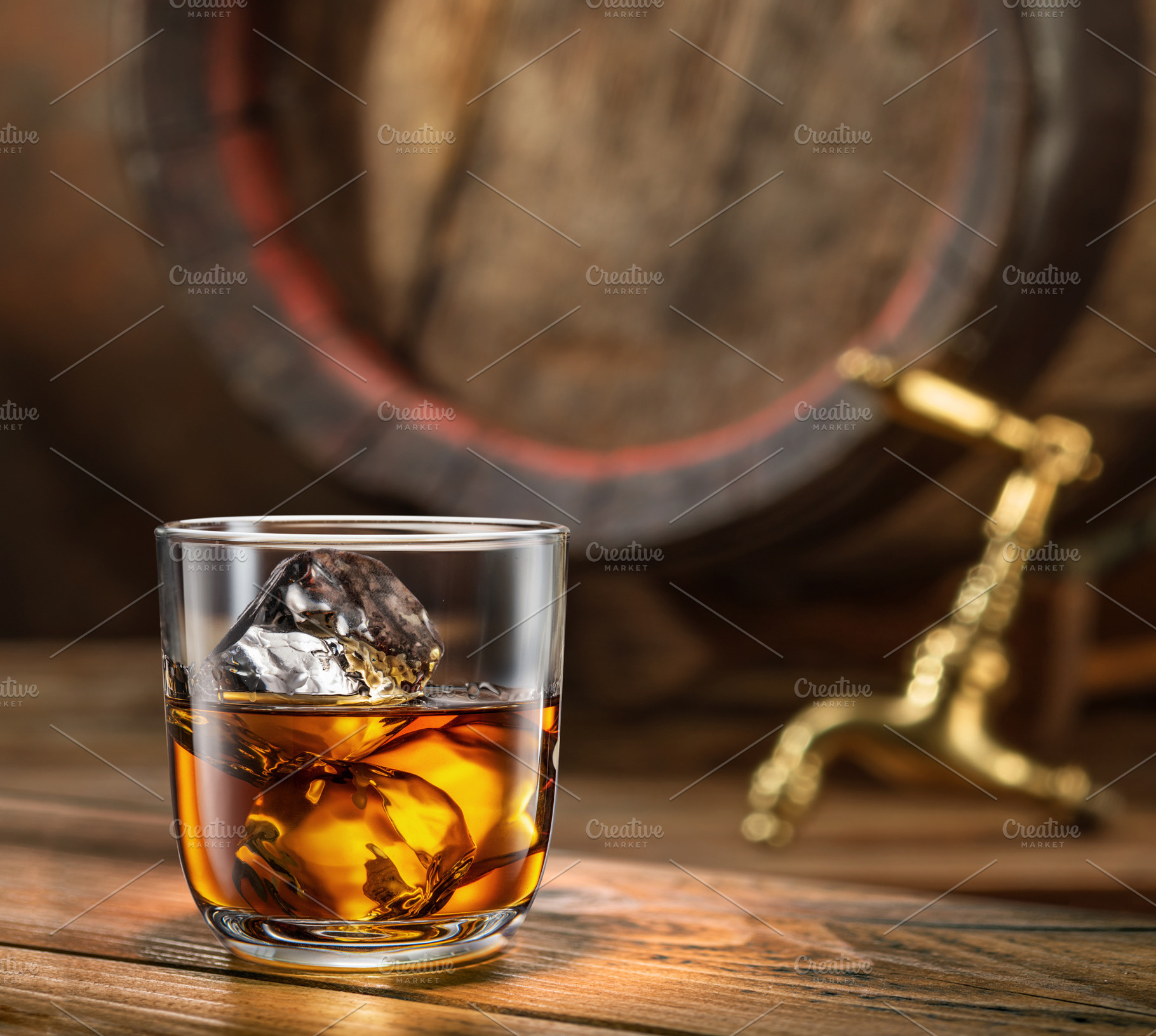Glass of whiskey on top of wooden, a Food & Drink Photo by Volff