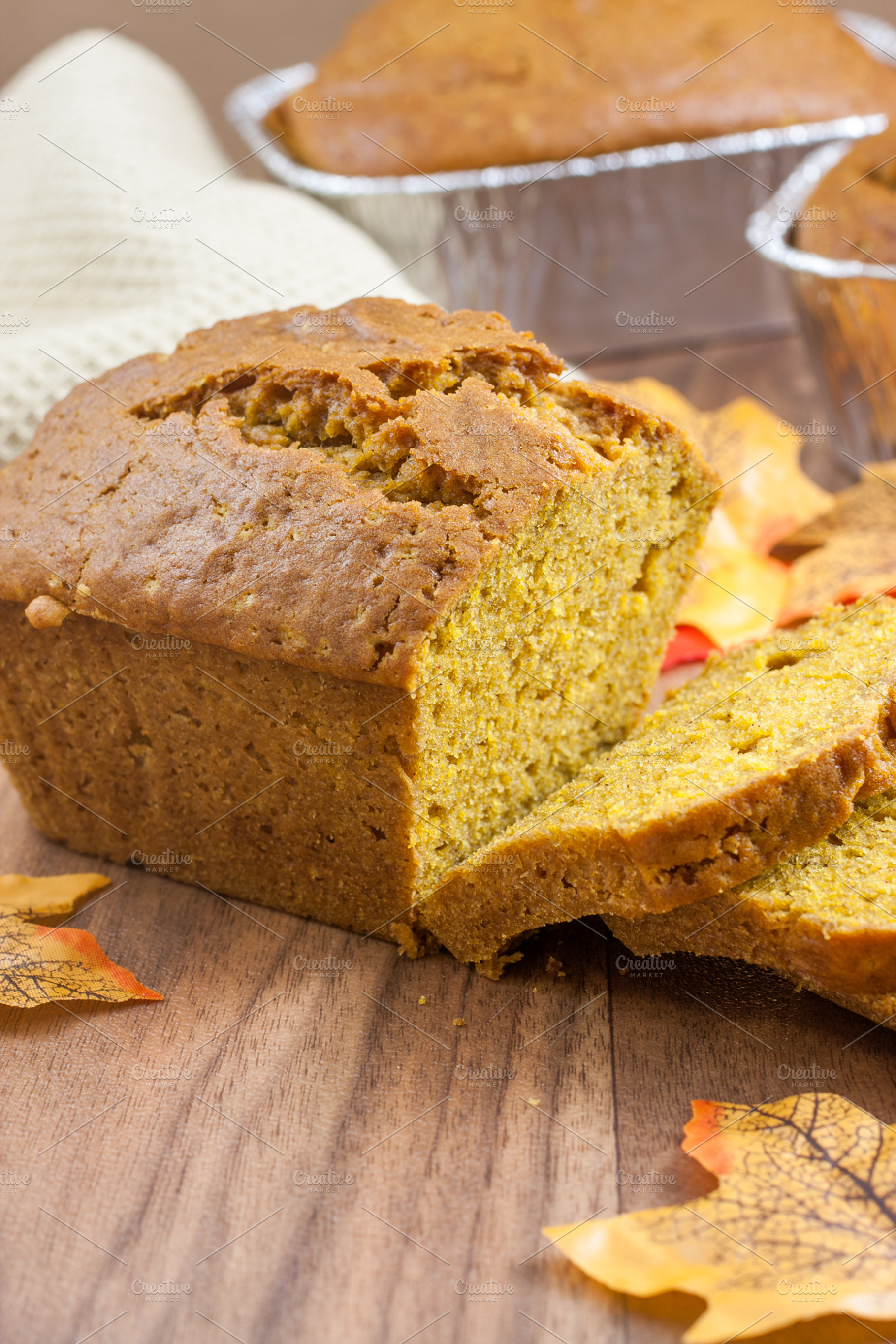 Mini pumpkin bread loaves featuring bread, pumpkin, and sliced