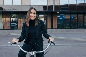 Young cheerful female in black, a Business Photo by Artem Varnitsin