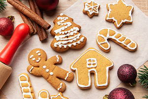 Homemade gingerbread cookies on baking paper for christmas, a Holiday Photo by Olena Rudo