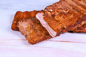 Cooked meat smoked ribs served on of