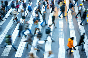 A crowd of pedestrians crossing a bu, a Photo by Iftikhar Alam