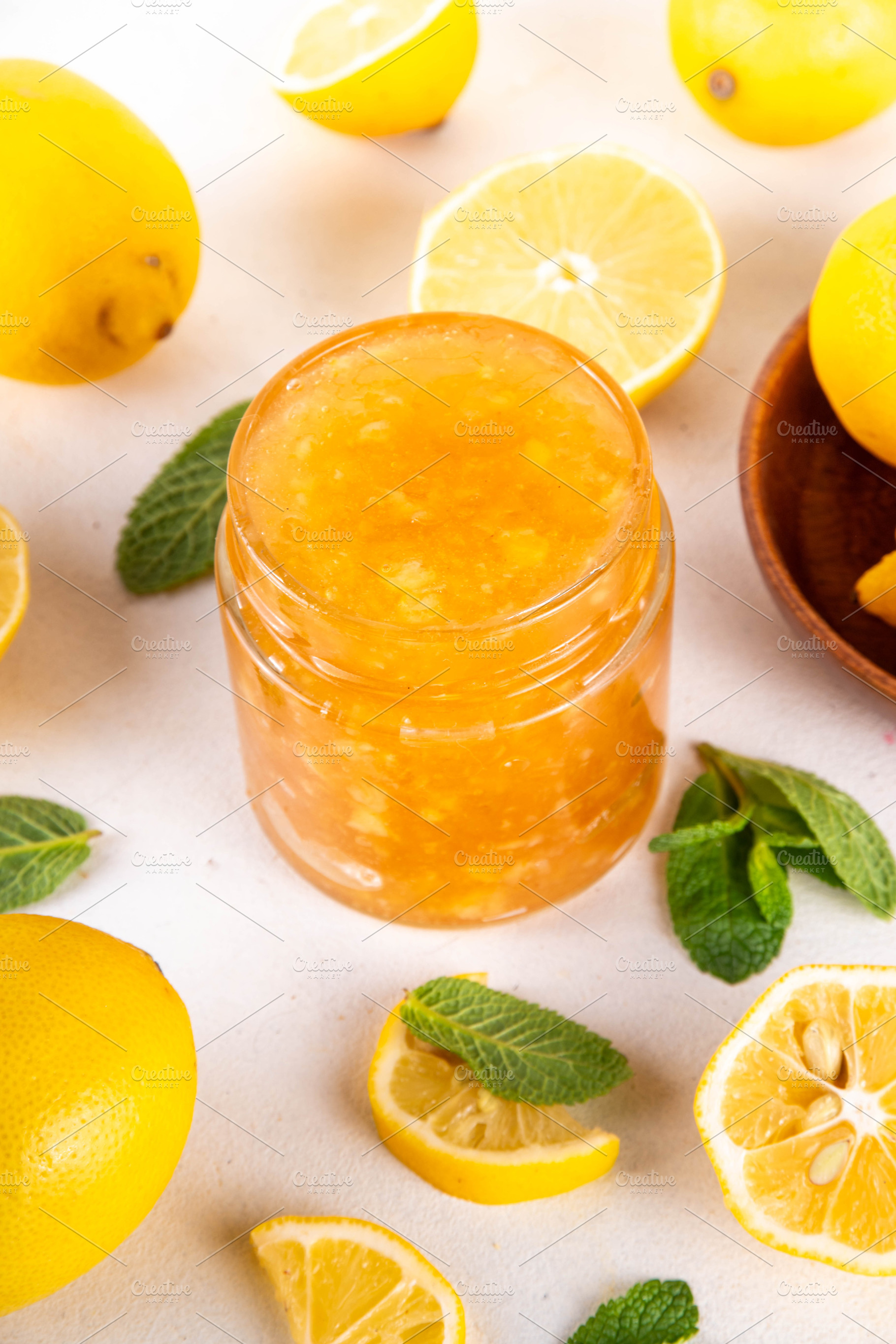 Sweet and sour lemon citrous jam in small jar, a Food & Drink Photo by Rimma