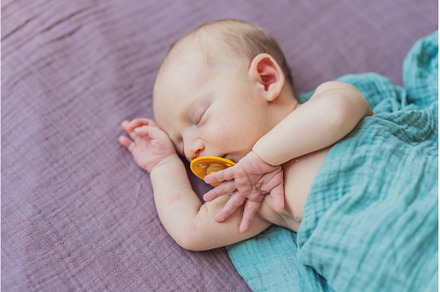 The baby is sleeping peacefully in, a Person Photo by Elizaveta Galitskaya