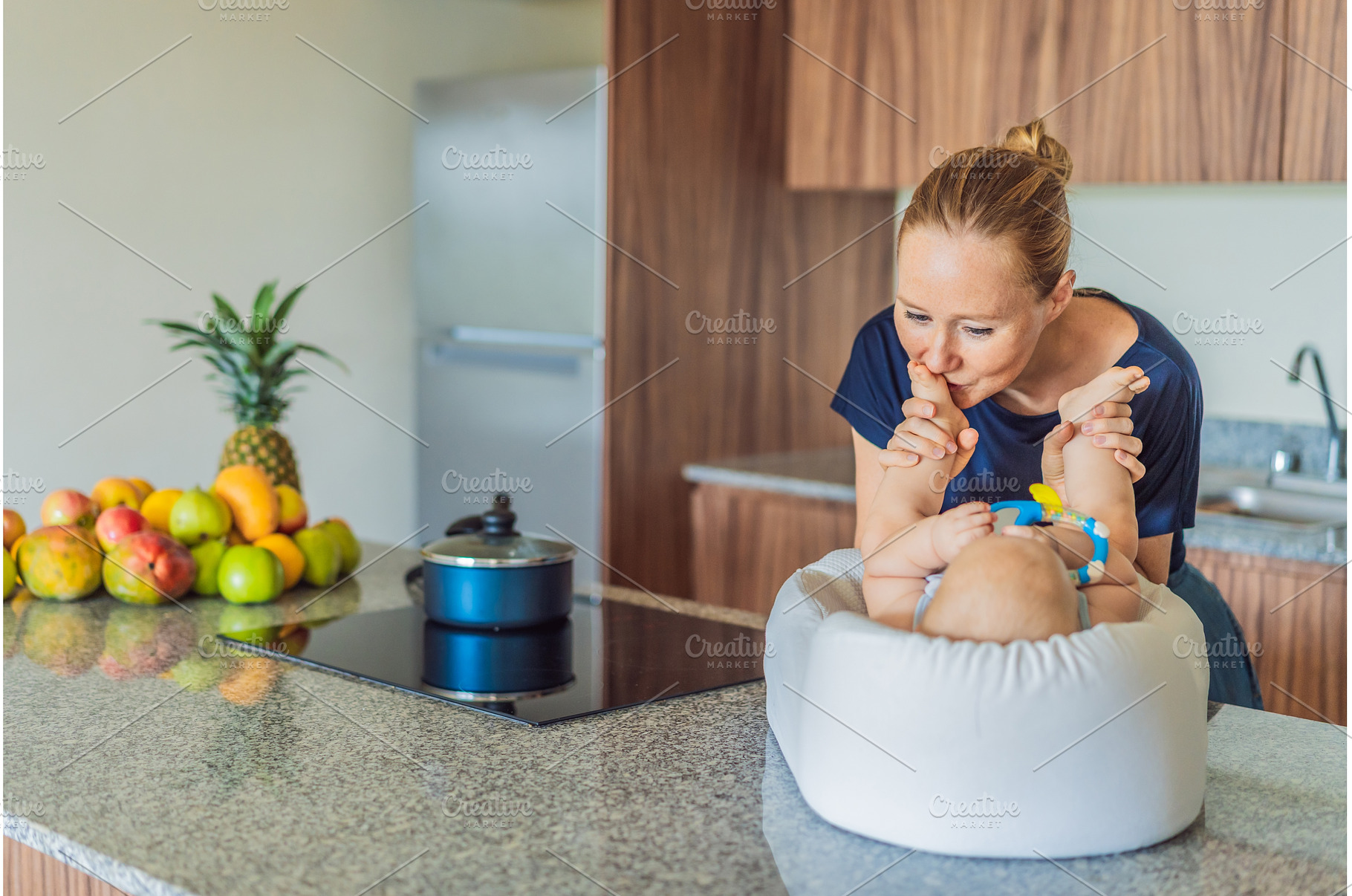 Mother talking to baby lying in cozy, a Person Photo by Elizaveta Galitskaya