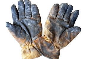Dirty leather work gloves isolated, an Industrial Photo by BOOCYS