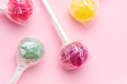Sweet lollipops on pink background, a Food & Drink Photo by Olena Rudo