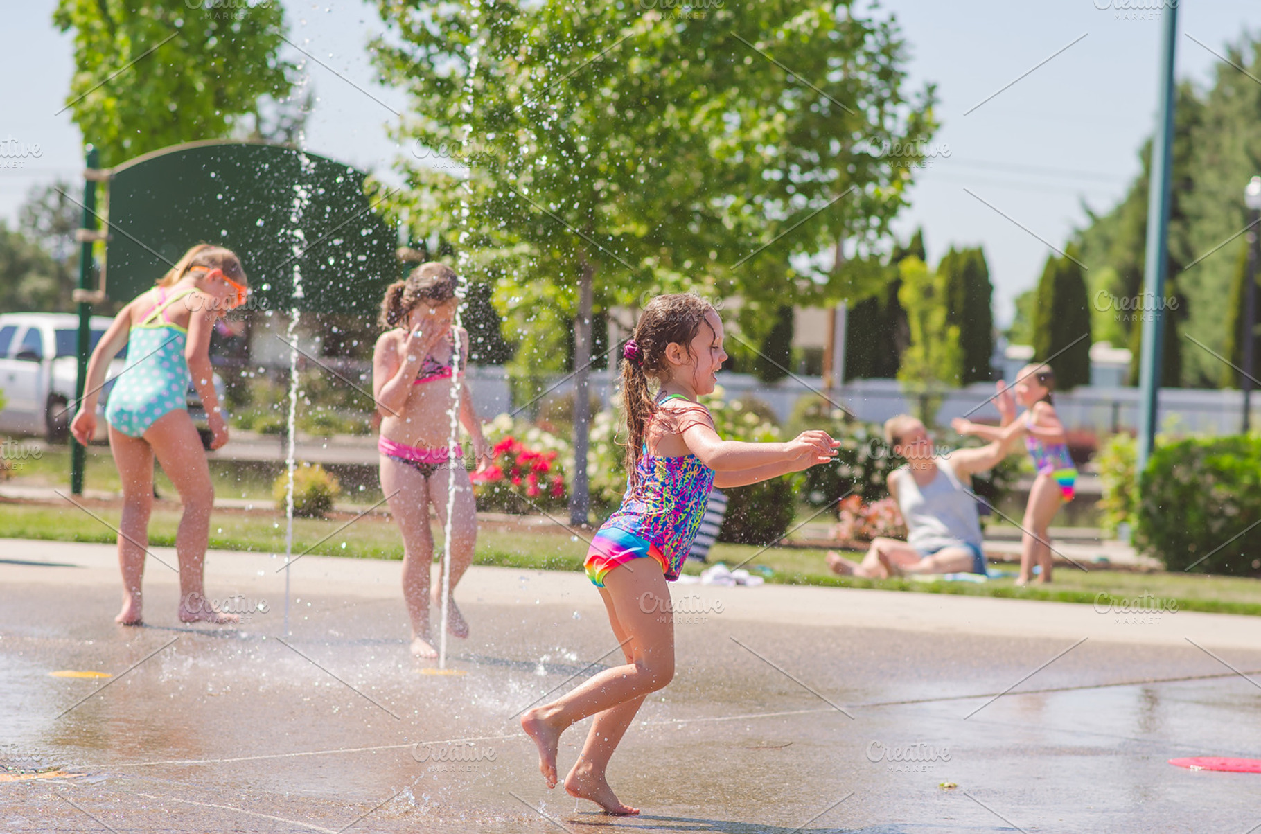 Girl child at splash park stock photo containing girl and summer, a Person Photo by Frizz Studio