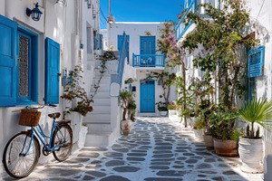Charming alley with blue doors, a Photo by Beautiful things