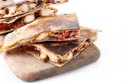 Mexican chicken quesadillas with cheese and peppers isolated on, a Food & Drink Photo by etorres69