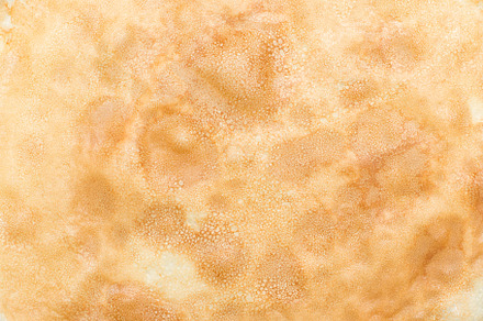 Close up texture of a pancake surface.