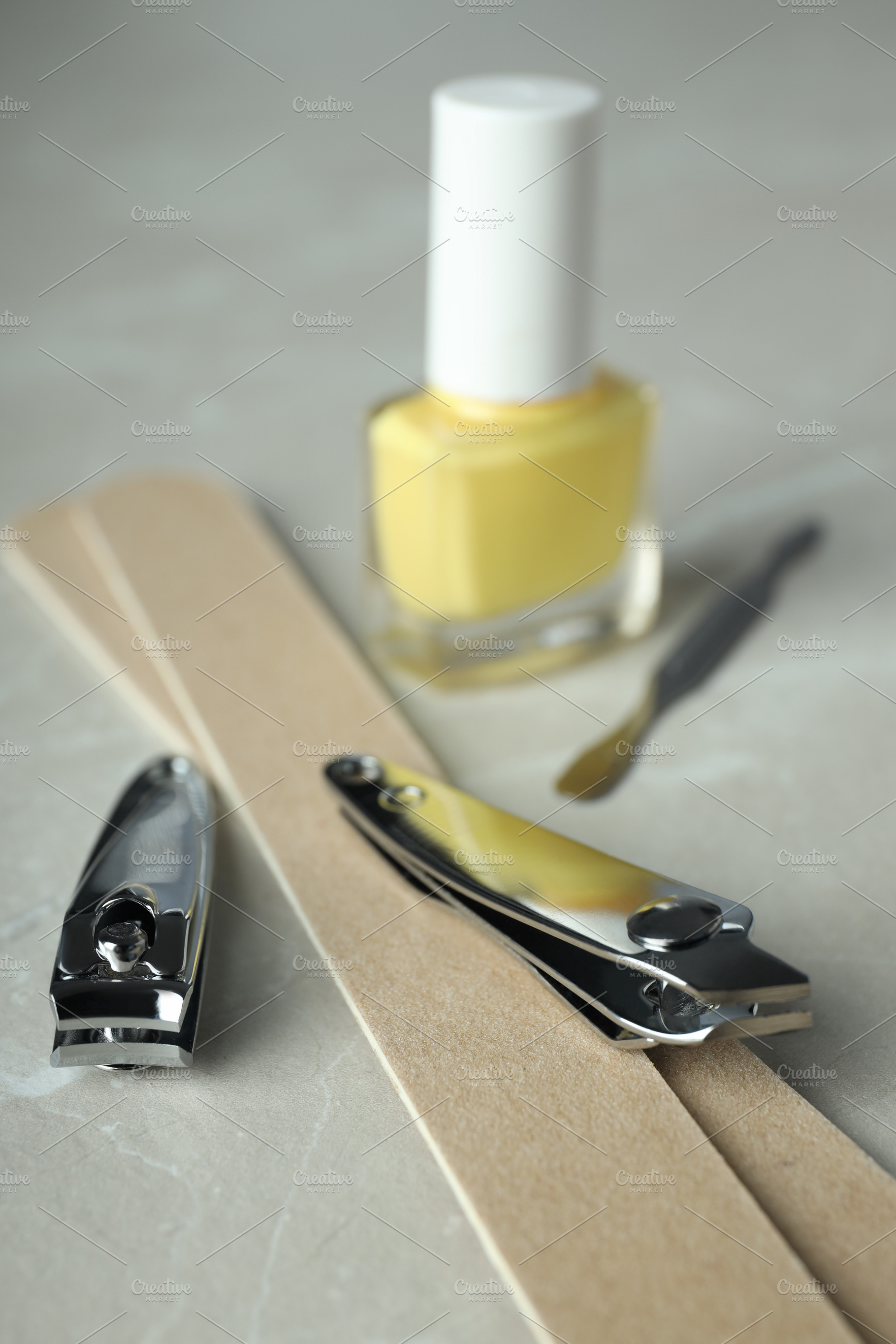 Concept of nail care with manicure accessories on light textured, a Beauty & Fashion Photo by AtlasStudio PRO