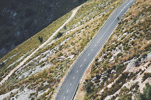 Winding mountain road, a Transportation Photo by SkyNext