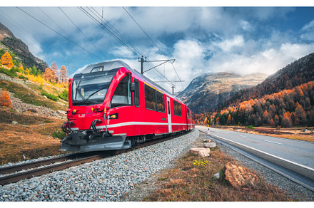 Red passenger train is moving on