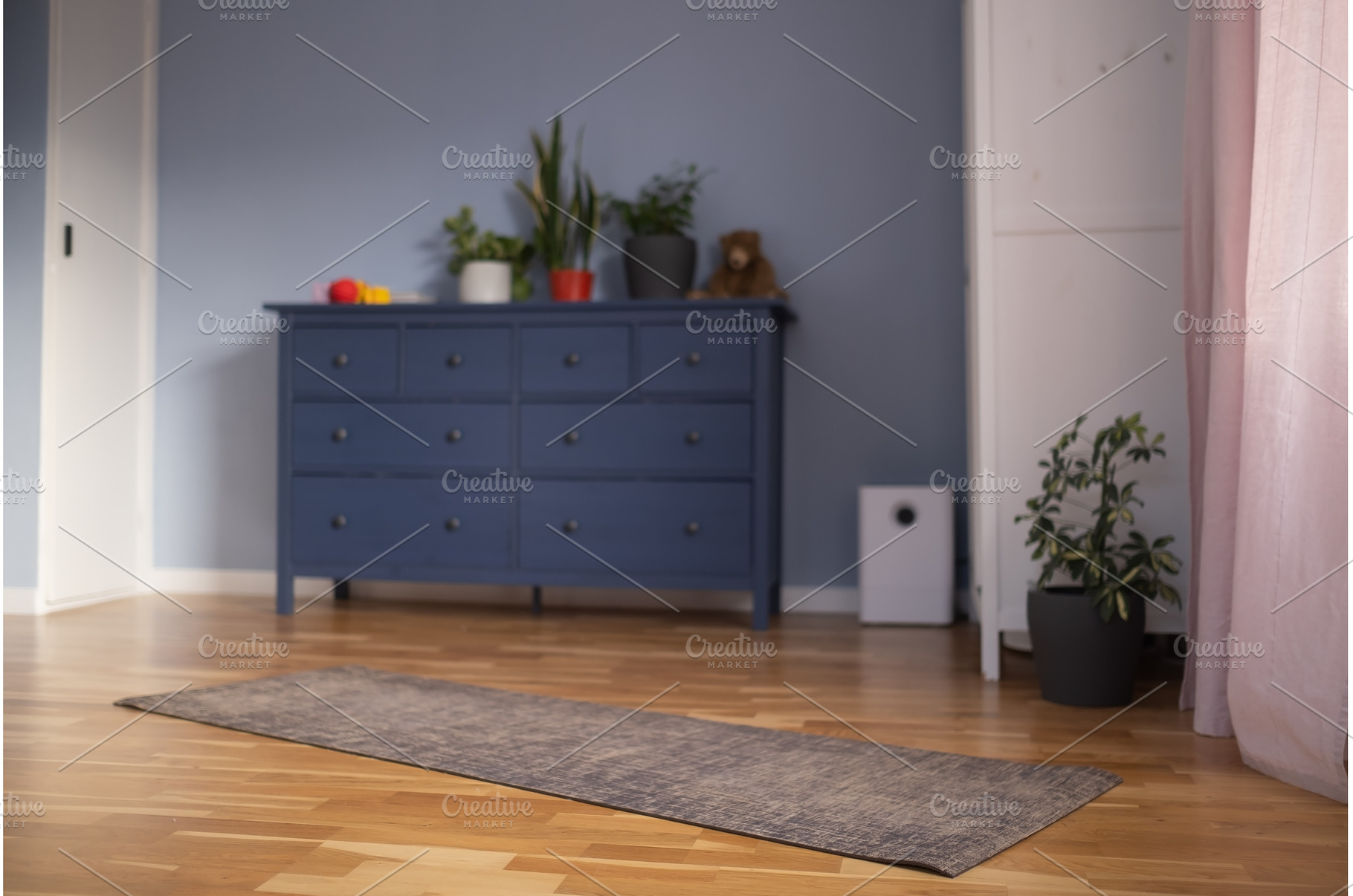 Yoga mat are placed on the carpet in, a Sports & Recreation Photo by Koldunova