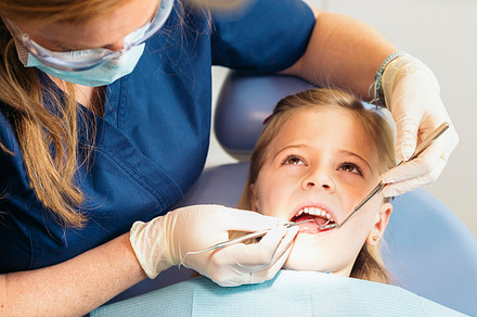 Dentists with a patient stock photo containing dental and dentist, a Health & Medical Photo by nunezimage