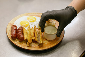 Serving lunch meal plate fried egg sausages chef, a Food & Drink Photo by Photo Drive Studio